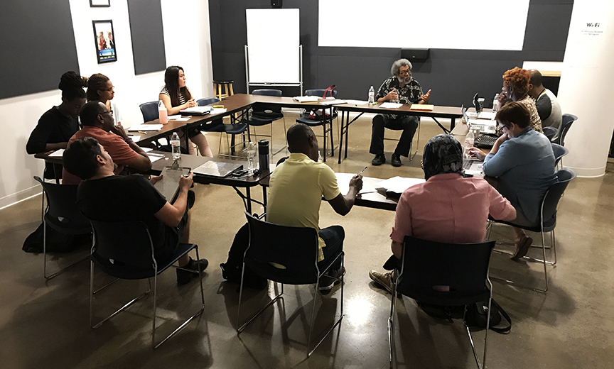 David Grant teaching a class of students sitting at tables