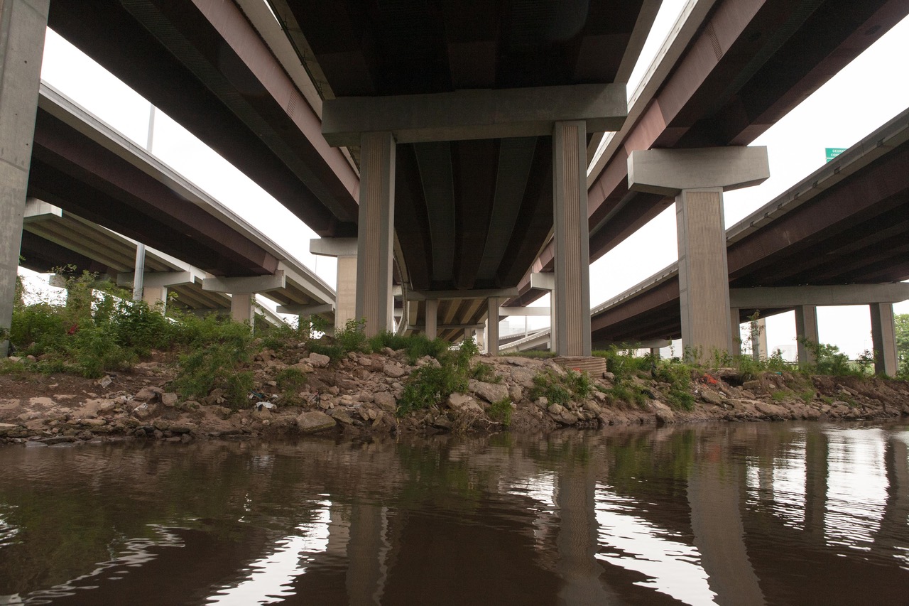 A creek that passes under several highway overpasses