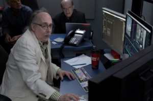 Skip Davis at an editor station with computer monitors